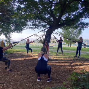 ladies working out round a tree